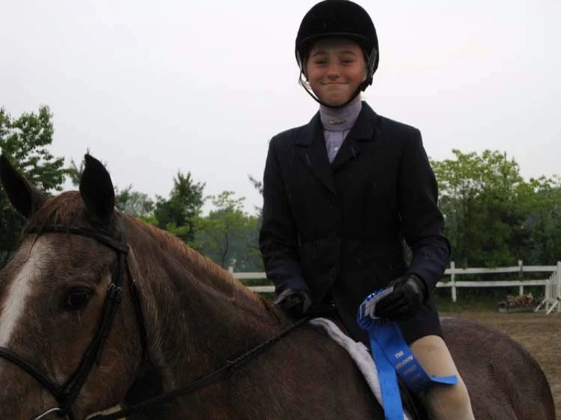 Hunt-seat riding lesson in the arena at Nimble Creek Farm